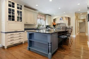 kitchen-with-cream-cabinets-and-blue-island